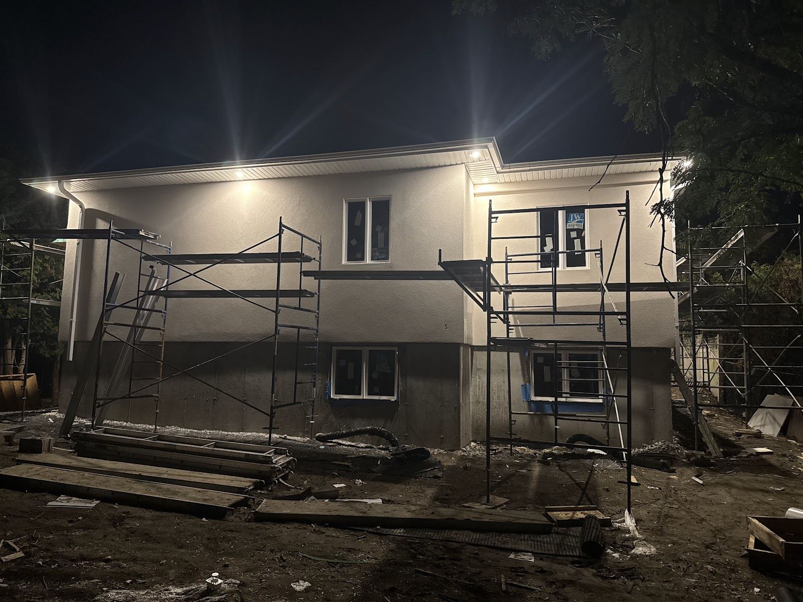 A new build at night with its soffit pot lights on
